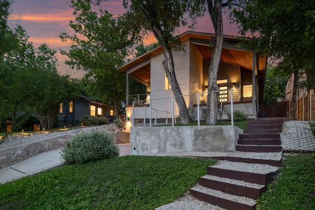 1303 Deloney St, Austin, TX 78721 - contemporary home featuring stairs and a porch
