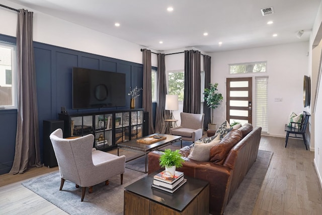 1303 Deloney St, Austin, TX 78721 - living area with light wood-type flooring and recessed lighting
