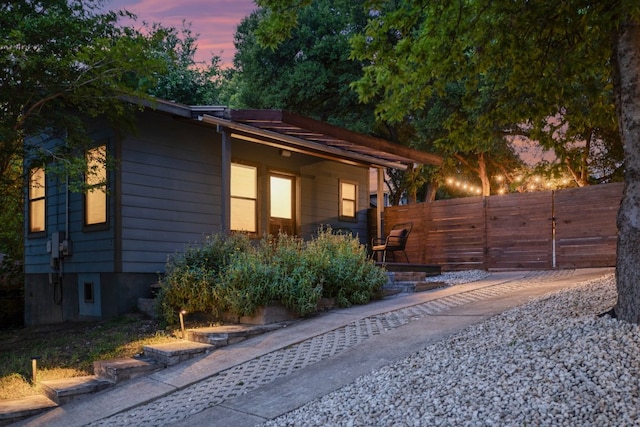 1305 Deloney St, Austin, TX 78721 - view of property exterior at dusk