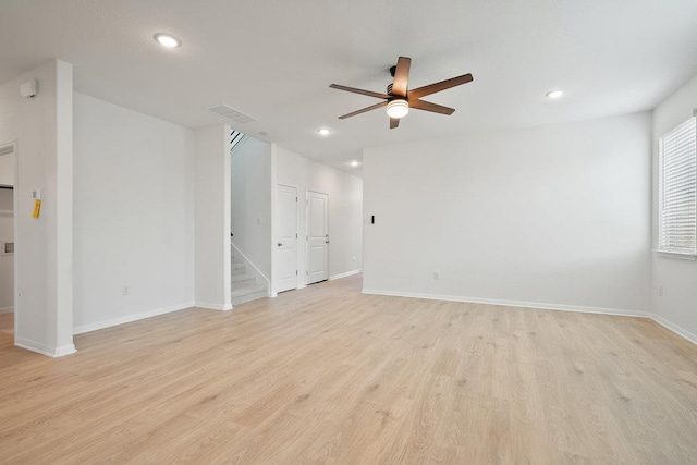 13228 Ditka Dr, Austin, TX 78652 - spare room with ceiling fan, light wood-type flooring, recessed lighting, and stairway