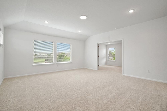 13228 Ditka Dr, Austin, TX 78652 - spare room with lofted ceiling, light colored carpet, and recessed lighting