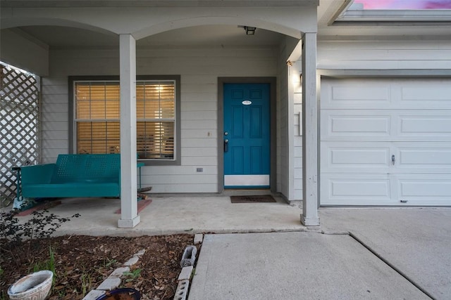 9206 Brents Elm Dr, Austin, TX 78744 - property entrance with a porch and an attached garage