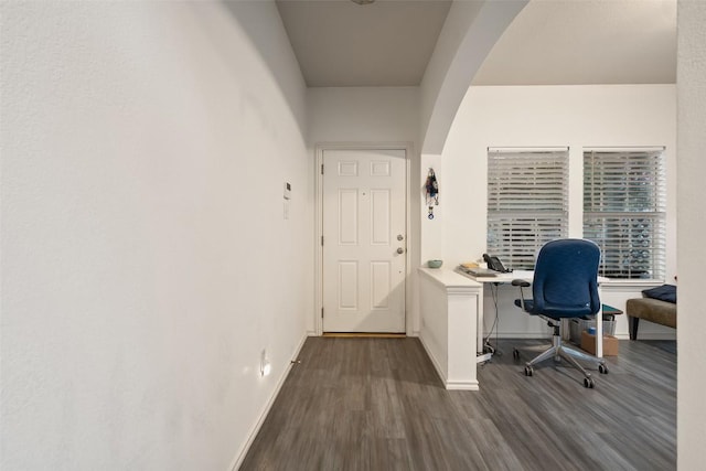 9206 Brents Elm Dr, Austin, TX 78744 - office area featuring dark wood-style floors and arched walkways