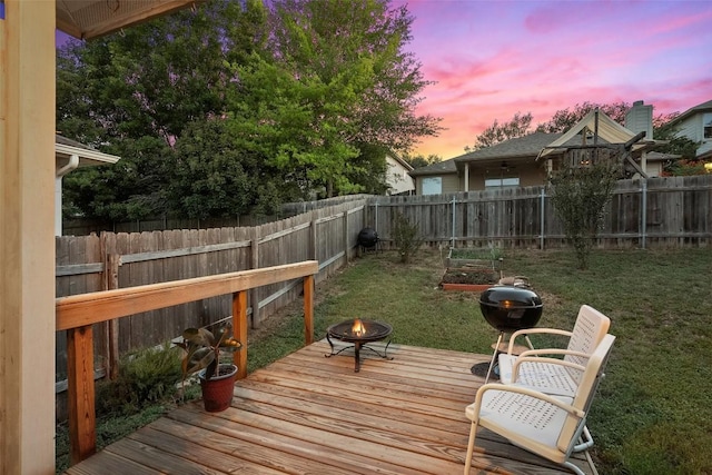 9206 Brents Elm Dr, Austin, TX 78744 - deck at dusk with a fire pit, a fenced backyard, and a grill