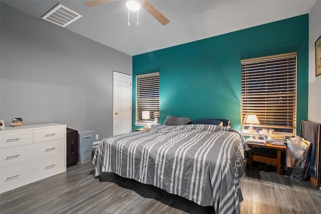 9206 Brents Elm Dr, Austin, TX 78744 - bedroom with wood finished floors and ceiling fan