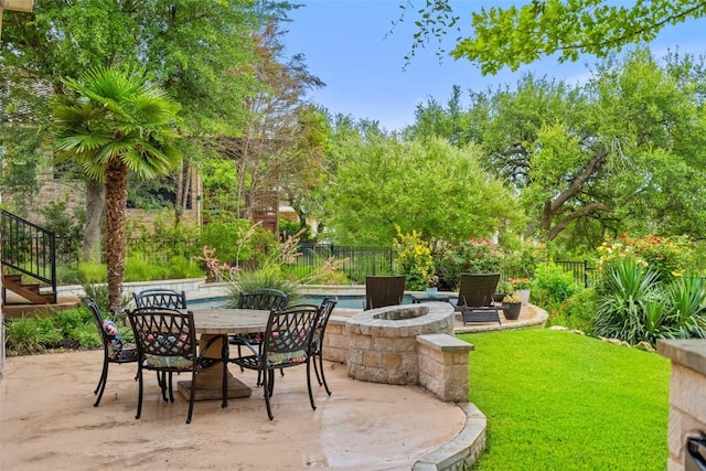 15908 Spillman Ranch Loop, Austin, TX 78738 - fenced backyard featuring an outdoor fire pit, a patio area, stairway, and outdoor dining space