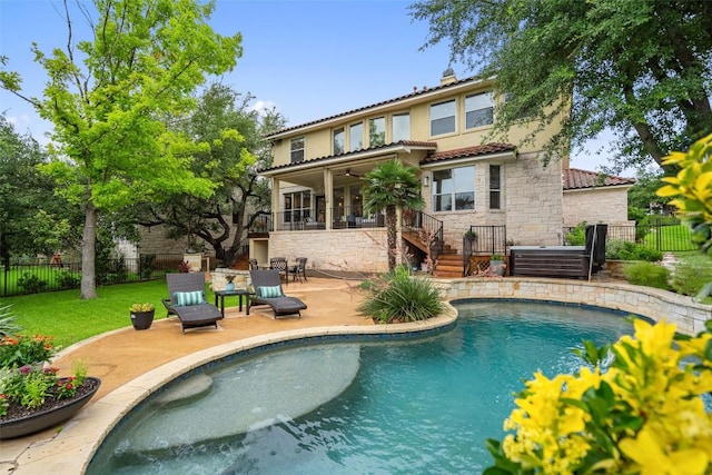 15908 Spillman Ranch Loop, Austin, TX 78738 - rear view of house with stone siding, a ceiling fan, a patio area, a tile roof, and stairs