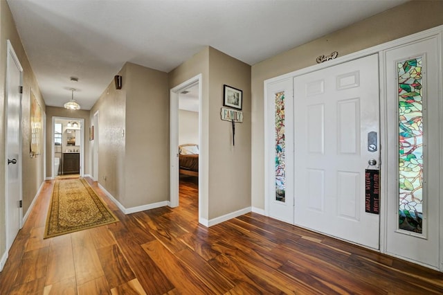 21013 Ridgeview Loop, Lago Vista, TX 78645 - foyer with dark wood-style flooring and baseboards