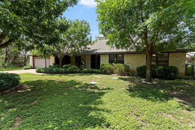 21013 Ridgeview Loop, Lago Vista, TX 78645 - view of front facade featuring a front lawn, a garage, and driveway