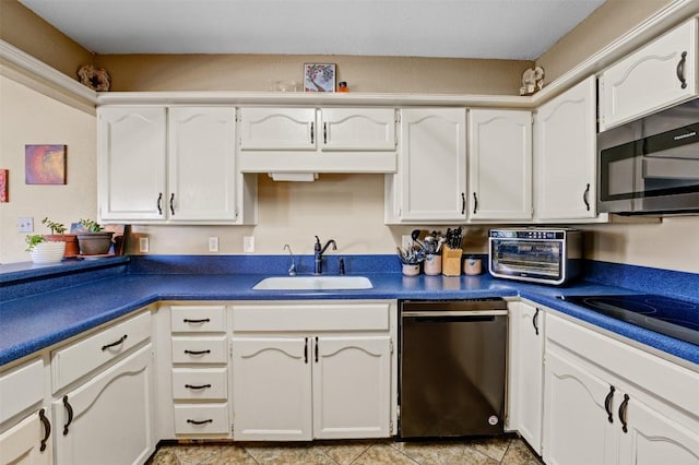 21013 Ridgeview Loop, Lago Vista, TX 78645 - kitchen with dishwashing machine, stainless steel microwave, dark countertops, and white cabinetry