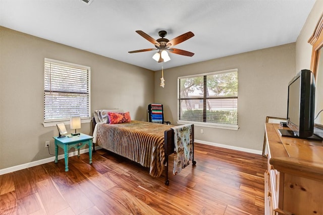 21013 Ridgeview Loop, Lago Vista, TX 78645 - bedroom featuring wood finished floors and ceiling fan