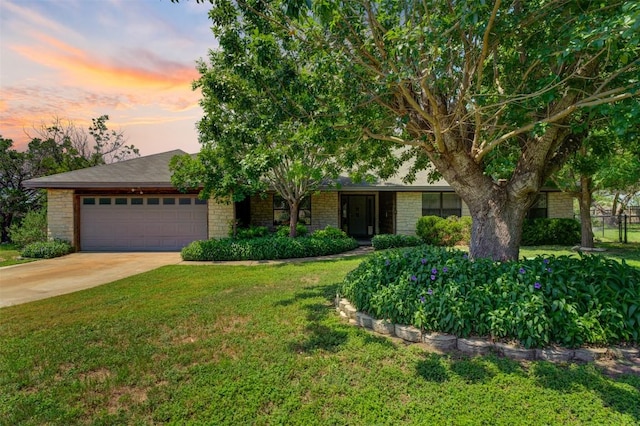 21013 Ridgeview Loop, Lago Vista, TX 78645 - view of front of property with a garage, brick siding, and driveway
