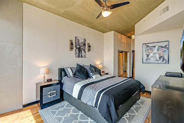 360 Nueces St Unit 3807, Austin, TX 78701 - bedroom with light wood-type flooring and ceiling fan