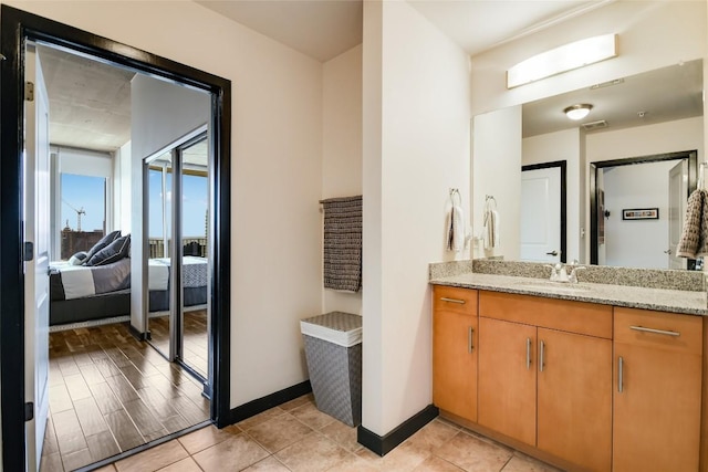 360 Nueces St Unit 3807, Austin, TX 78701 - ensuite bathroom featuring vanity and baseboards