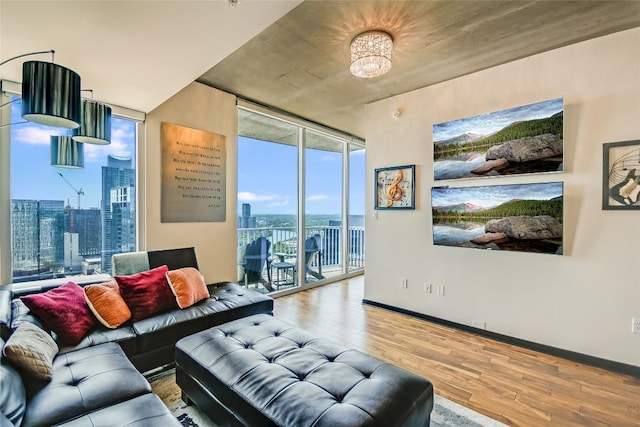 360 Nueces St Unit 3807, Austin, TX 78701 - living area with floor to ceiling windows, wood finished floors, and a view of city