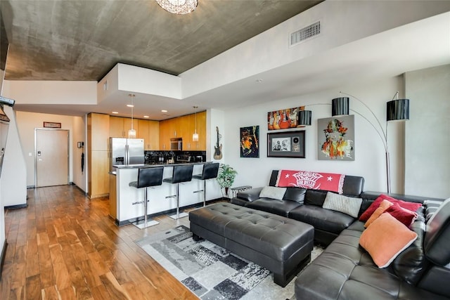 360 Nueces St Unit 3807, Austin, TX 78701 - living room featuring wood finished floors