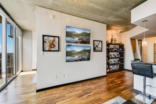 360 Nueces St Unit 3807, Austin, TX 78701 - living area with wood finished floors and a wall of windows