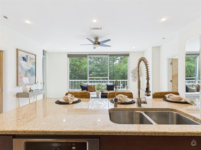 1600 Barton Springs Rd Unit 5107, Austin, TX 78704 - kitchen featuring open floor plan, recessed lighting, light stone countertops, and ceiling fan
