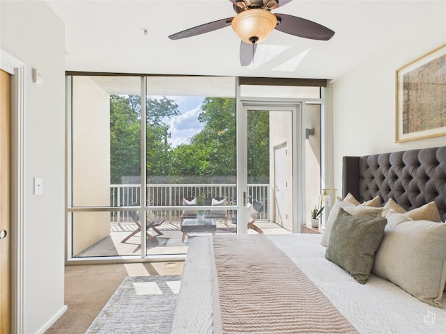 1600 Barton Springs Rd Unit 5107, Austin, TX 78704 - carpeted bedroom featuring expansive windows, access to exterior, a ceiling fan, and a skylight