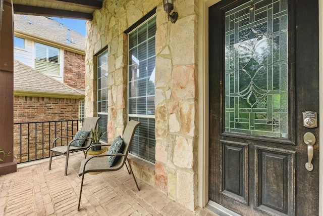7617 Roaring Springs Dr, Austin, TX 78736 - view of exterior entry featuring stone siding and covered porch