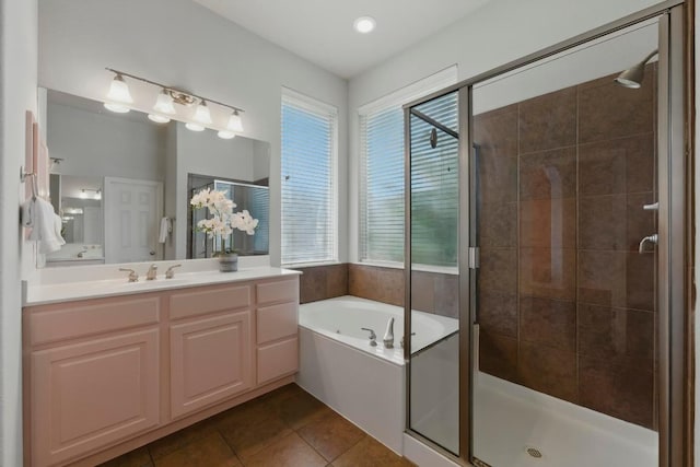 7617 Roaring Springs Dr, Austin, TX 78736 - bathroom featuring a shower stall, vanity, a garden tub, and tile patterned floors