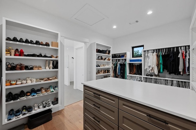 111 Rock N Robyn Trl, Horseshoe Bay, TX 78657 - spacious closet featuring attic access and light wood-style flooring