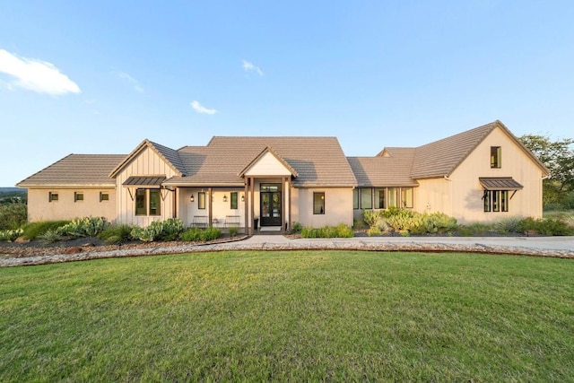 111 Rock N Robyn Trl, Horseshoe Bay, TX 78657 - modern inspired farmhouse featuring board and batten siding, a front yard, a tile roof, and french doors
