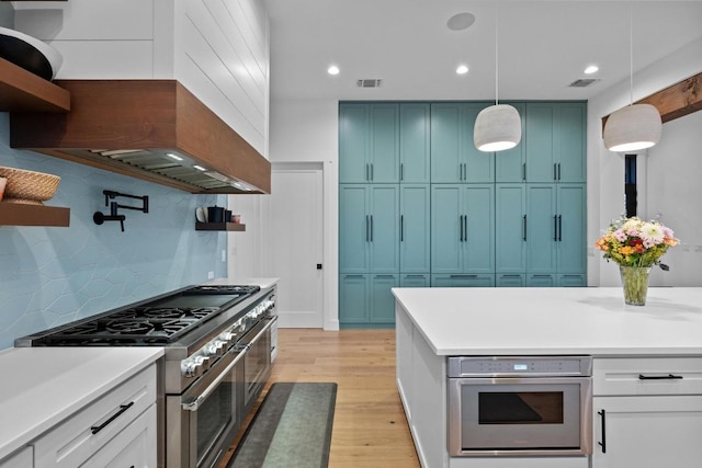111 Rock N Robyn Trl, Horseshoe Bay, TX 78657 - kitchen with range with two ovens, blue cabinets, wall oven, open shelves, and tasteful backsplash