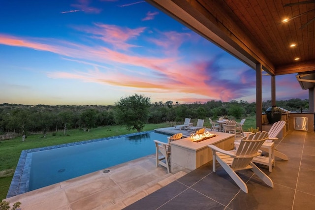 111 Rock N Robyn Trl, Horseshoe Bay, TX 78657 - view of patio with a fire pit and an outdoor kitchen