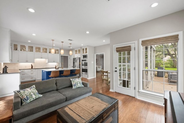 509 Explorer Dr, Lakeway, TX 78734 - living room featuring recessed lighting and wood finished floors