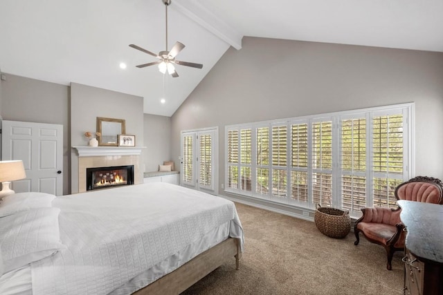 509 Explorer Dr, Lakeway, TX 78734 - carpeted bedroom with high vaulted ceiling, beam ceiling, a glass covered fireplace, and a ceiling fan