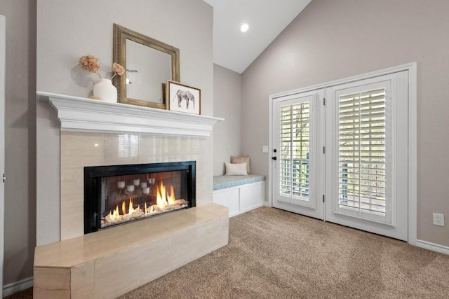 509 Explorer Dr, Lakeway, TX 78734 - unfurnished living room with a fireplace, lofted ceiling, carpet flooring, and recessed lighting