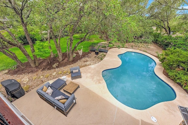 509 Explorer Dr, Lakeway, TX 78734 - swimming pool with a patio area and view of scattered trees