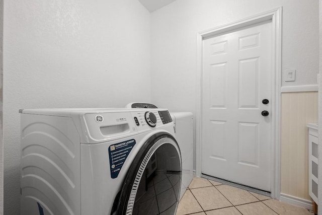 509 Explorer Dr, Lakeway, TX 78734 - laundry area featuring washer and clothes dryer and light tile patterned floors