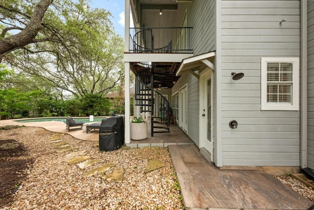 509 Explorer Dr, Lakeway, TX 78734 - doorway to property with an outdoor pool, a patio, and a balcony
