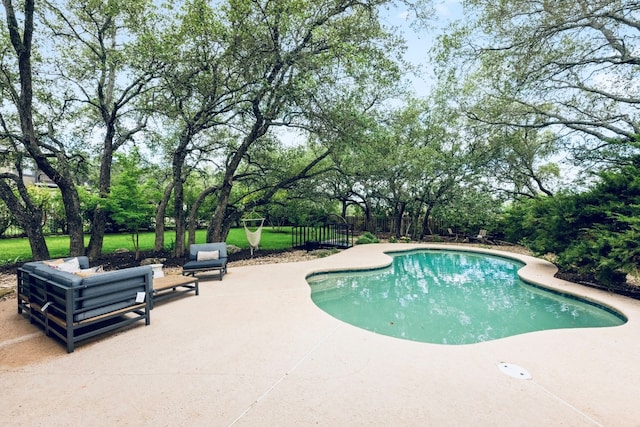 509 Explorer Dr, Lakeway, TX 78734 - outdoor pool with a patio area and view of scattered trees