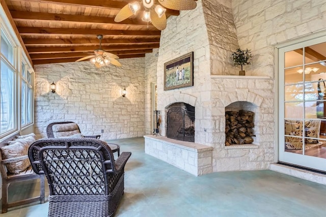 7503 Stonecliff Cir, Austin, TX 78731 - living area featuring wood ceiling, ceiling fan, concrete flooring, and an outdoor stone fireplace