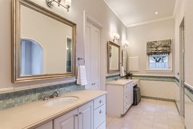 7503 Stonecliff Cir, Austin, TX 78731 - bathroom featuring tile walls, two vanities, tile patterned floors, crown molding, and wainscoting