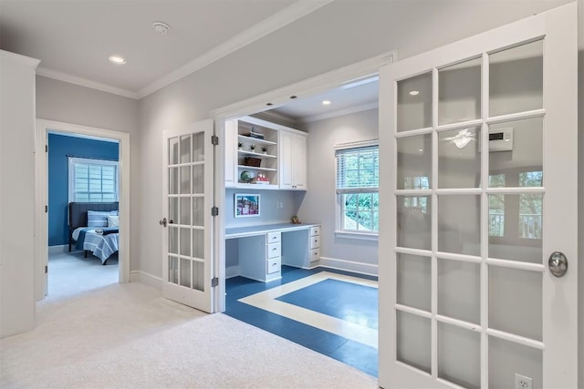 7503 Stonecliff Cir, Austin, TX 78731 - corridor with crown molding, a desk, french doors, light carpet, and plenty of natural light