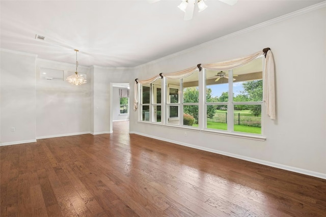 130 Enchanted Dr, Georgetown, TX 78633 - unfurnished room featuring a ceiling fan, a chandelier, wood finished floors, and crown molding