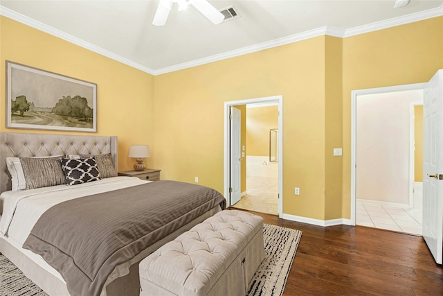 130 Enchanted Dr, Georgetown, TX 78633 - bedroom featuring hardwood / wood-style floors, ornamental molding, connected bathroom, and a ceiling fan