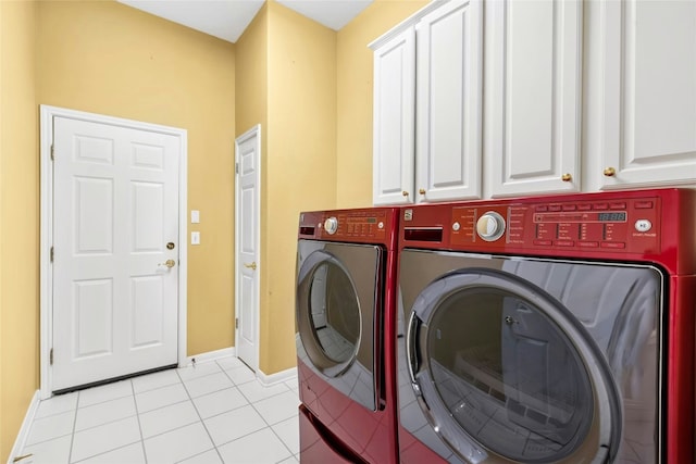 130 Enchanted Dr, Georgetown, TX 78633 - laundry area with washing machine and dryer, cabinet space, and light tile patterned flooring