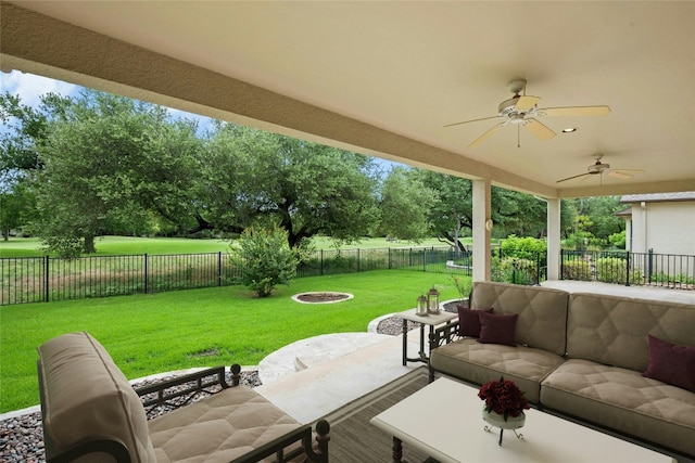 130 Enchanted Dr, Georgetown, TX 78633 - fenced backyard with an outdoor living space, a ceiling fan, and a patio area