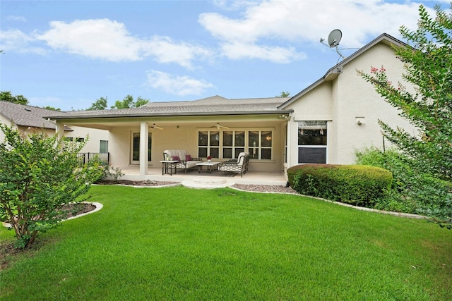 130 Enchanted Dr, Georgetown, TX 78633 - back of property with ceiling fan, stucco siding, a yard, and a patio area
