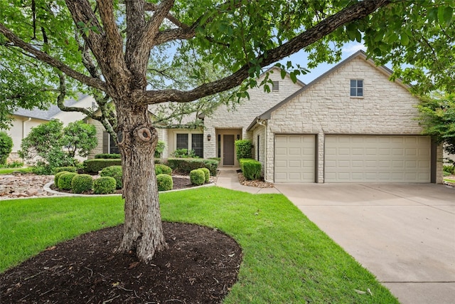 130 Enchanted Dr, Georgetown, TX 78633 - view of front of property featuring stone siding, a garage, a front yard, and driveway