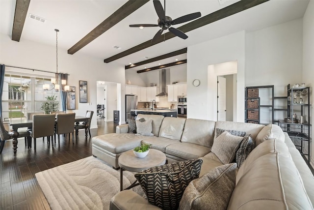 147 William Hersee Dr, Bastrop, TX 78602 - living room featuring beam ceiling, a chandelier, ceiling fan, dark wood finished floors, and recessed lighting
