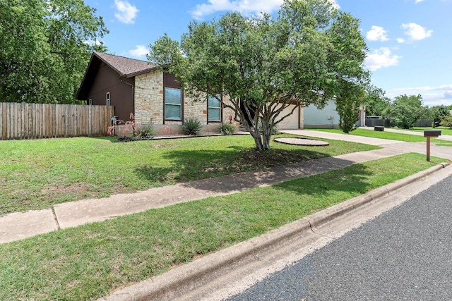907 Great Oaks Cv, Round Rock, TX 78681 - view of front of house featuring stone siding and driveway