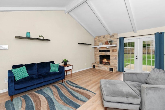 907 Great Oaks Cv, Round Rock, TX 78681 - living area with french doors, wood finished floors, and a stone fireplace