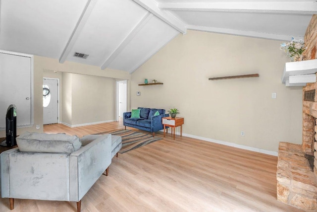 907 Great Oaks Cv, Round Rock, TX 78681 - living room with light wood finished floors and a fireplace with raised hearth