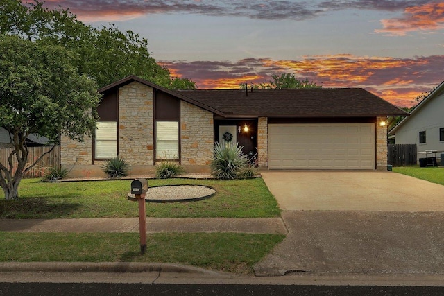 907 Great Oaks Cv, Round Rock, TX 78681 - mid-century modern home featuring stone siding, driveway, and a garage